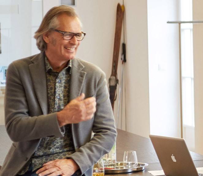  Hans Taubenberger sitting on a desk next to a computer